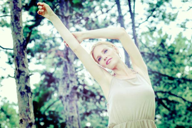 istock Young beautiful happy woman in park 668540770