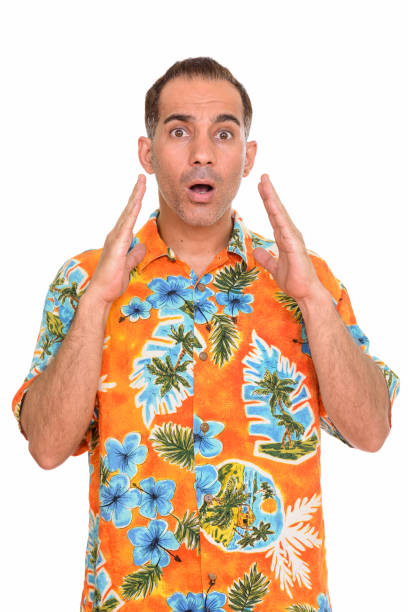 istock Mature handsome Persian tourist man ready for vacation looking shocked 668541640