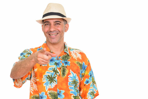 istock Mature happy Persian tourist man smiling while pointing at camera 668541720