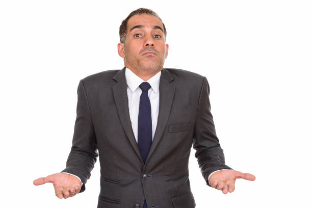 istock Mature handsome Persian businessman shrugging shoulders 668547006