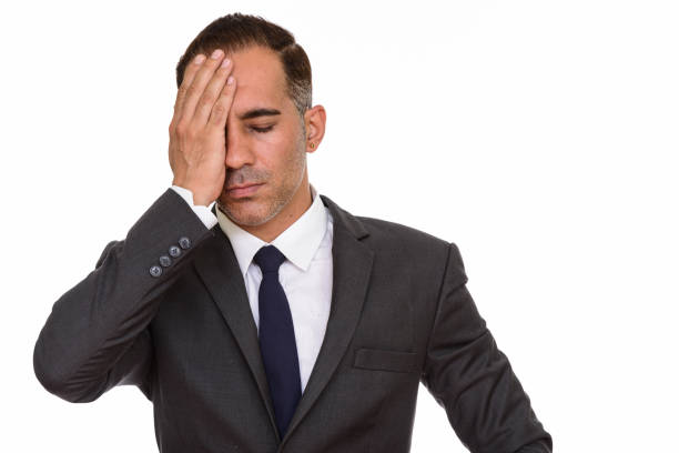 istock Mature stressed Persian businessman looking tired 668547048