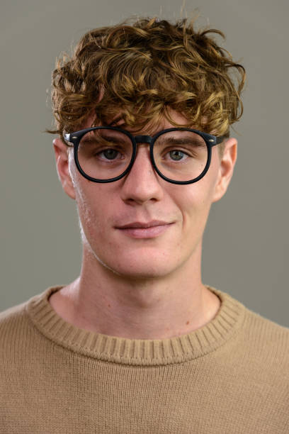 istock Face of young handsome nerd man wearing eyeglasses 668549948