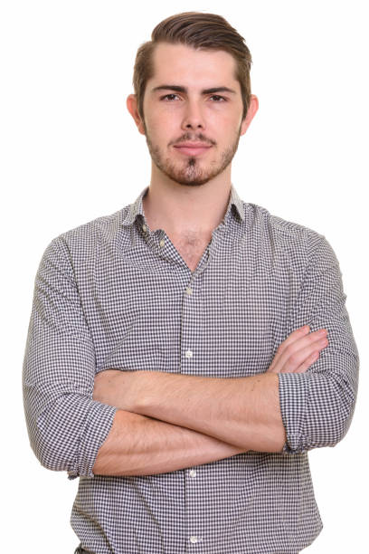 istock Young handsome businessman with arms crossed 668550944