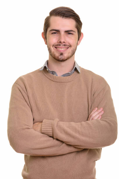 istock Young happy handsome man smiling with arms crossed 668551048