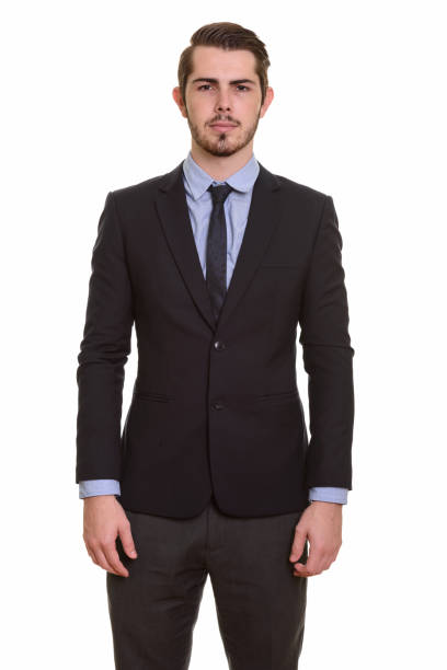 istock Young handsome businessman standing against white background 668551388