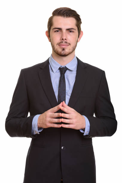 istock Young handsome businessman with fingertips together 668551472