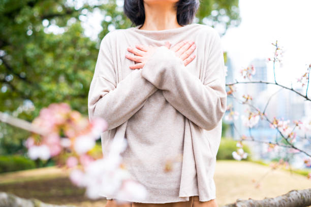 istock Woman and cherry blossom 668551920