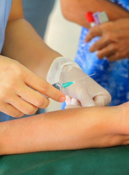 istock doctor injection needle selective focus  syringe  on arm 668560626