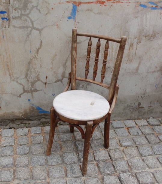 istock chair ancient  in the old brick wall. 668561522