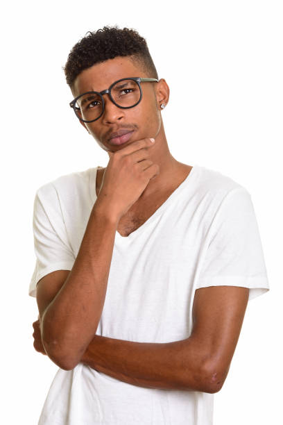 istock Young handsome African man thinking while wearing eyeglasses 668562504