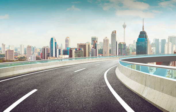 istock Highway overpass modern city skyline background . Day time scene . 668562548