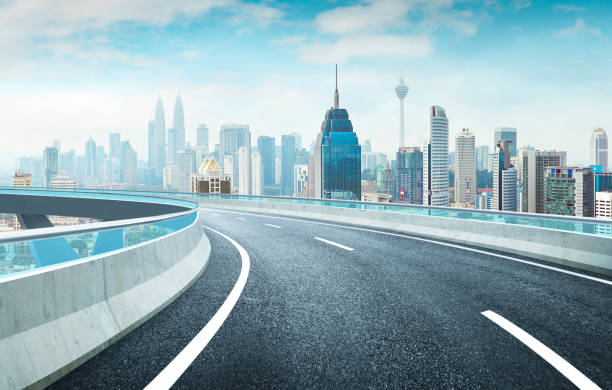 istock Highway overpass modern city skyline background . Day time scene . 668562574