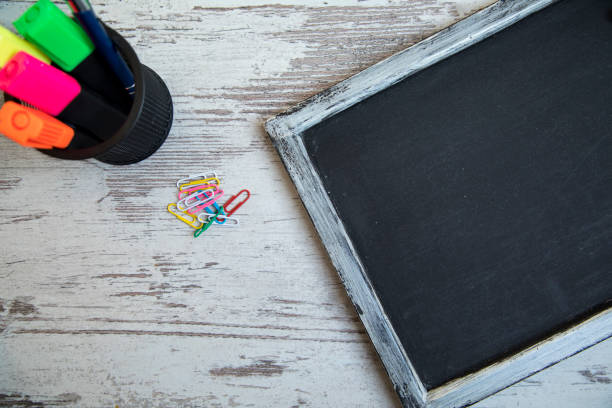 istock Small blackboard on old wood background 668562644