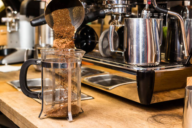 istock Barista making non traditional coffee in french press 668565404