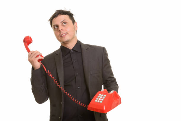 istock Studio shot of businessman holding telephone while thinking 668569262