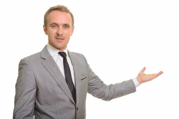 istock Handsome businessman showing copy space 668572570