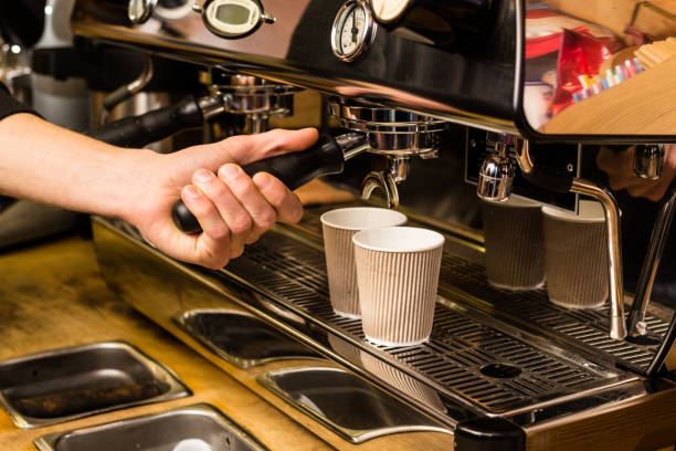 istock Barista making fresh takeaway coffee. 668574830