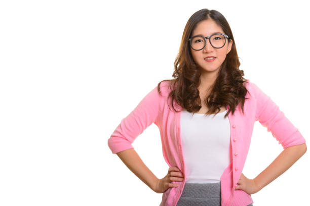 istock Young happy Asian woman smiling while wearing eyeglasses 668581638