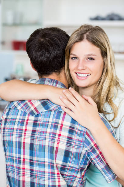 istock Happy young couple cuddling 668581676