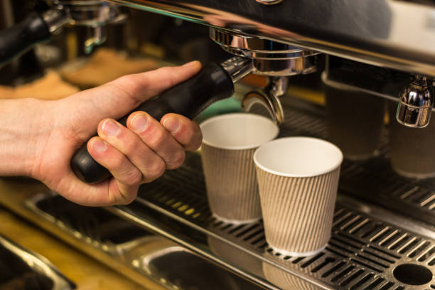 istock Barista making fresh takeaway coffee. 668582664