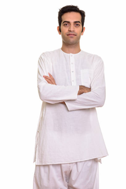istock Young Indian man standing with arms crossed while wearing traditional clothes 668582732