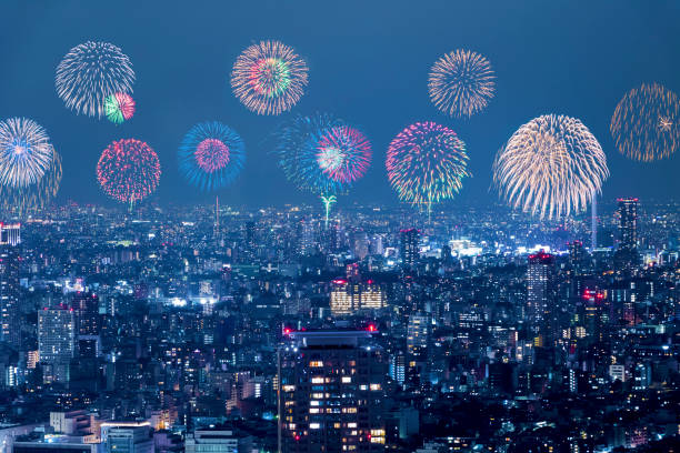 istock modern city night view and skyrocket fireworks 668583080