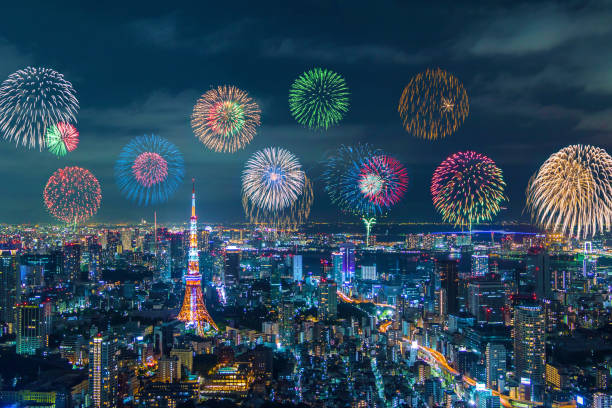 istock modern city night view and skyrocket fireworks 668583144