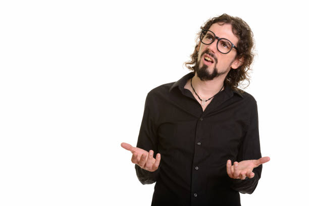 istock Handsome man looking confused while thinking and wearing eyeglasses 668589110