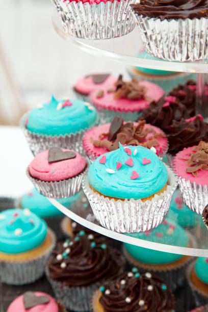 istock Wedding Cake Cupcake Tower Pink and Blue Icing 668590442
