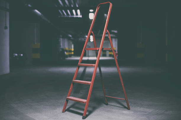 istock Red ladder in underground parking 668593672