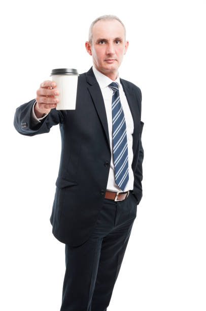 istock Senior elegant man holding coffee cup 668596810