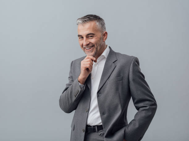 istock Businessman thinking with hand on chin 668596860