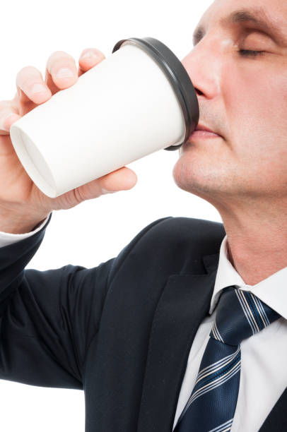 istock Close-up of senior elegant man drinking takeaway coffee 668596884