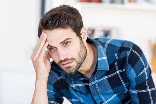 istock Close-up of tensed young man 668596926