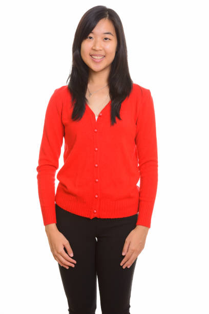 istock Young happy Asian woman smiling while standing 668599534