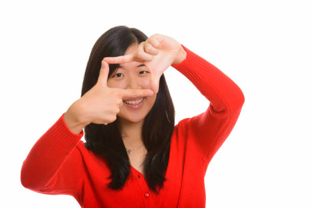 istock Young happy Asian woman focusing 668599680