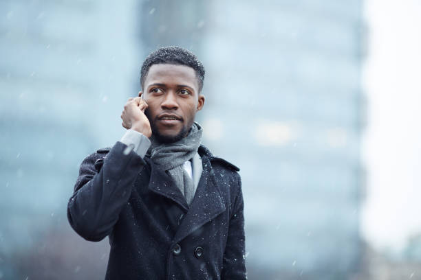 istock Handsome African Man on Phone in Street 668600050