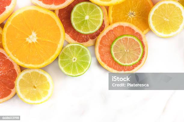 Grapefruit Lime Lemon And Orange Slices With Copyspace Stock Photo - Download Image Now