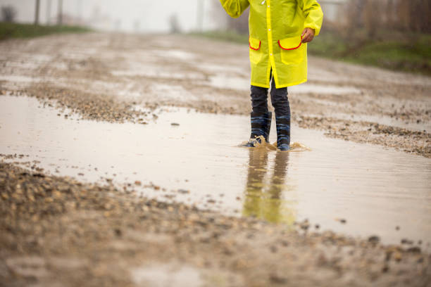 istock A young boy outside in the rain 668606834
