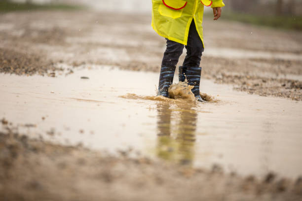 istock A young boy outside in the rain 668609524