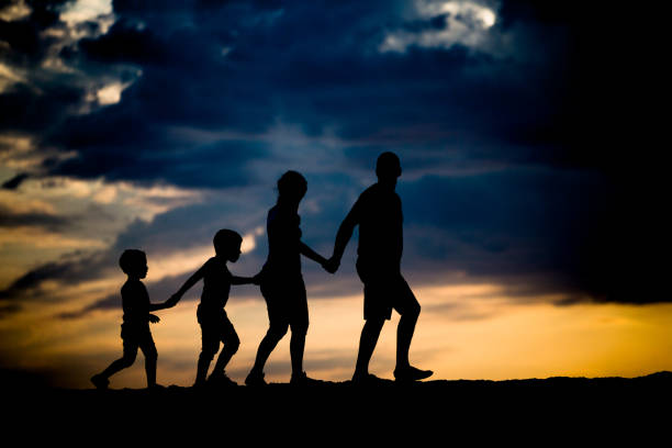 istock Young Family Walking Together on Dust 668610318