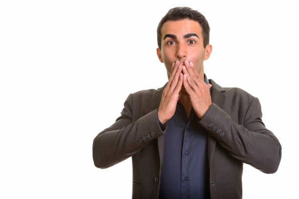 istock Young handsome Persian businessman looking surprised 668612750