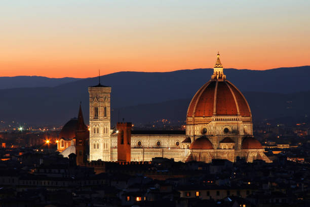 istock Florence Duomo Cathedral by night taken from Michelangelo Hill. 668616090