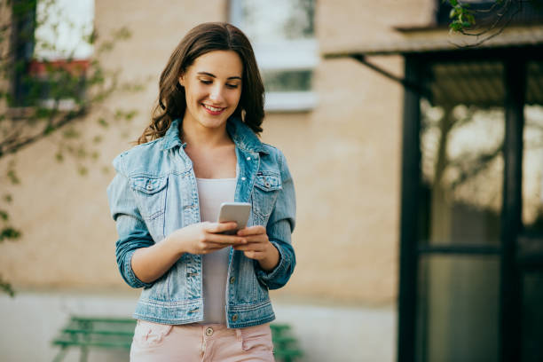 istock teenager girl using smart phone 668616148