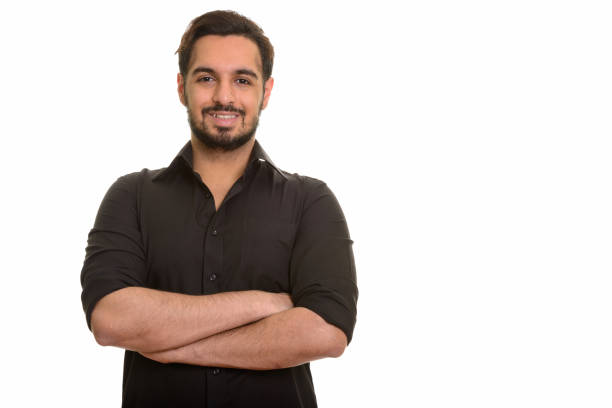 istock Young happy Indian man smiling with arms crossed 668616312