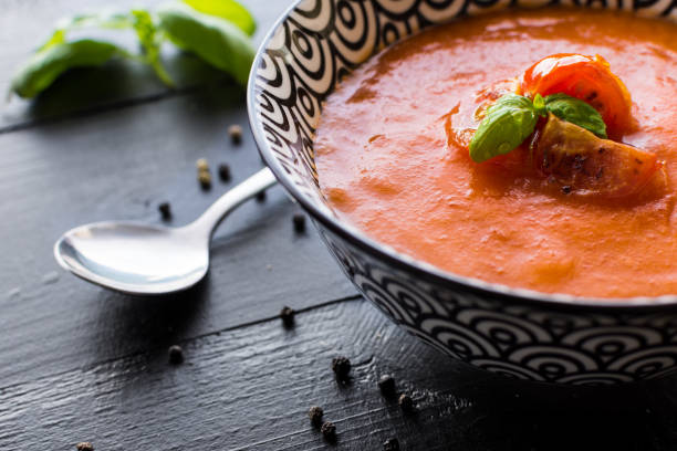 istock Vegetarian Tomato Soup on Dark Wooden Background 668617096