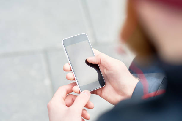 istock Male Hands Holding Smartphone 668621034