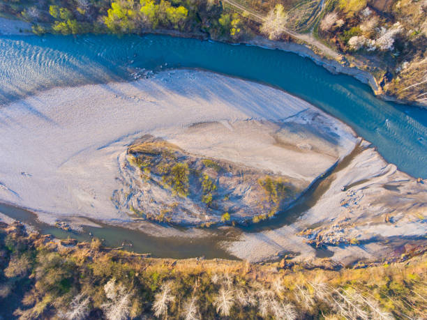 istock Aerial view. The bottom of the shallow river. Spring evening. Drone photo 668634412