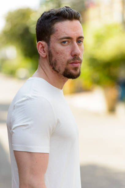 istock Young handsome man thinking while looking away outdoors 668638492