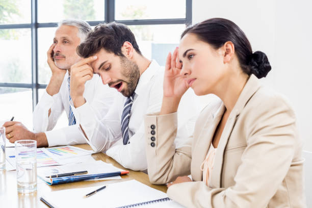istock Business colleagues getting bored in a meeting 668641212